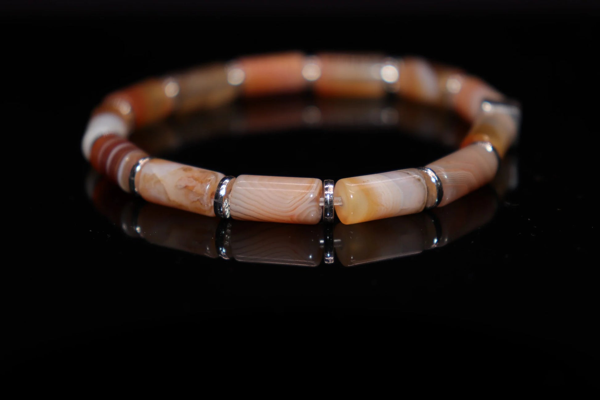 Close-up detail of agate bracelet showing mesmerizing layered stripes stone texture, Roman Emperor Nero cup sacred power gemstone jewelry