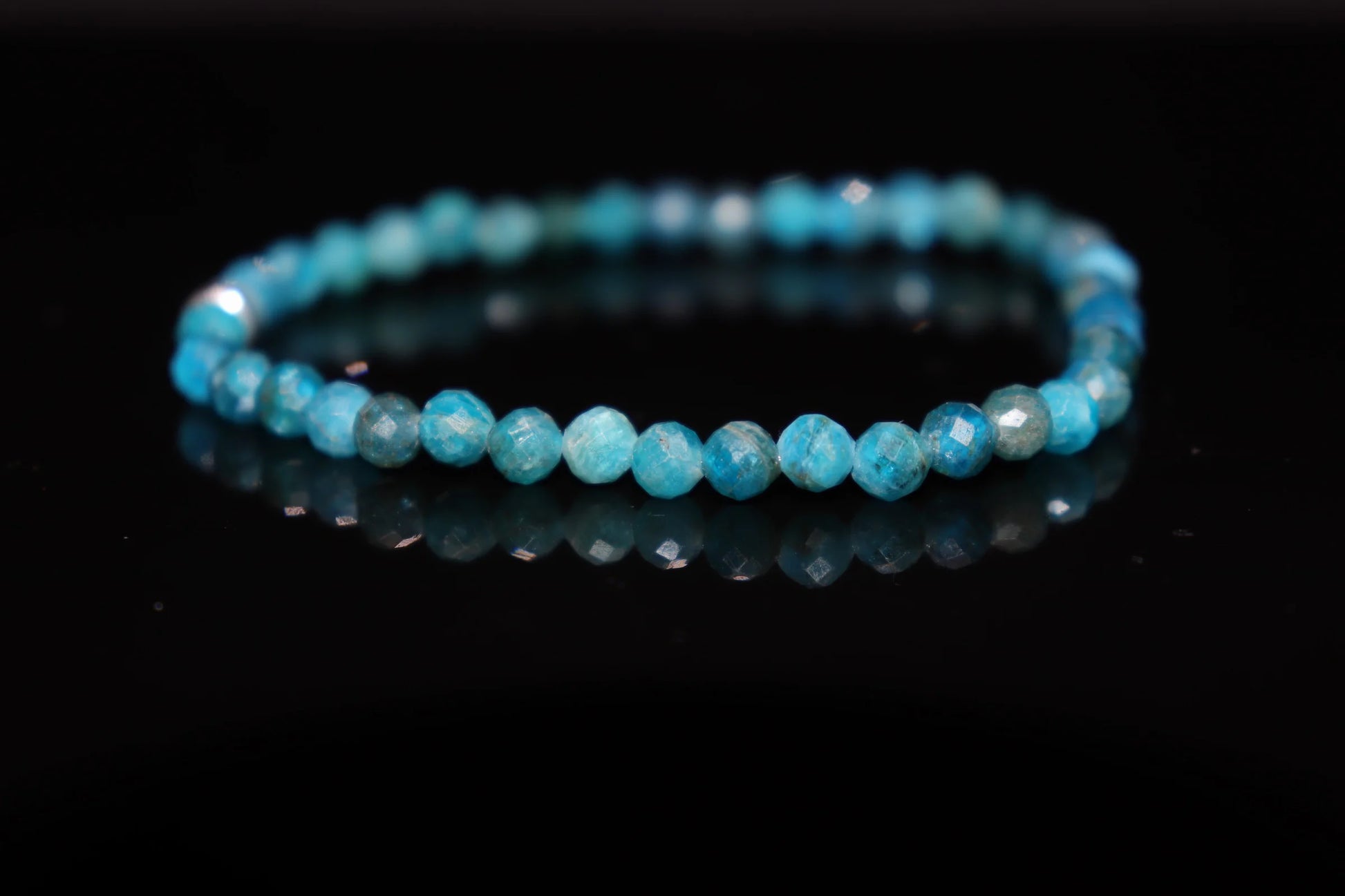 Blue apatite silver bracelet worn on wrist, spiritual vision awakening crystal jewelry for lucid dreaming and intuitive communication, healing accessory