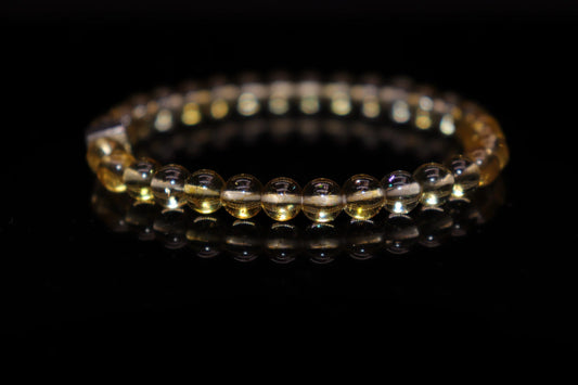 Citrine silver bracelet worn on wrist, merchant stone wealth attraction jewelry for solar plexus chakra confidence and creativity, prosperity accessory