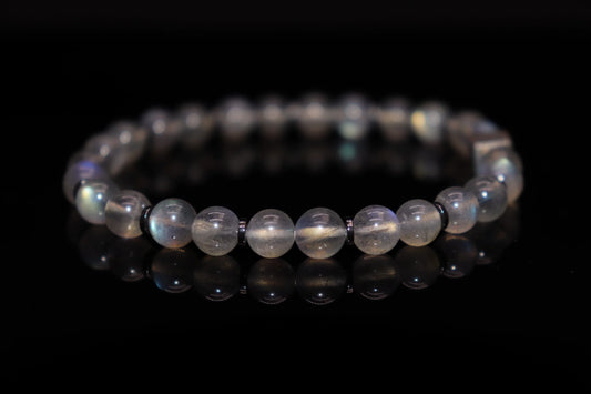 Close-up detail of grey moonstone bracelet showing ethereal silver sheen and adularescence effect, night sky fragment native legend gemstone jewelry