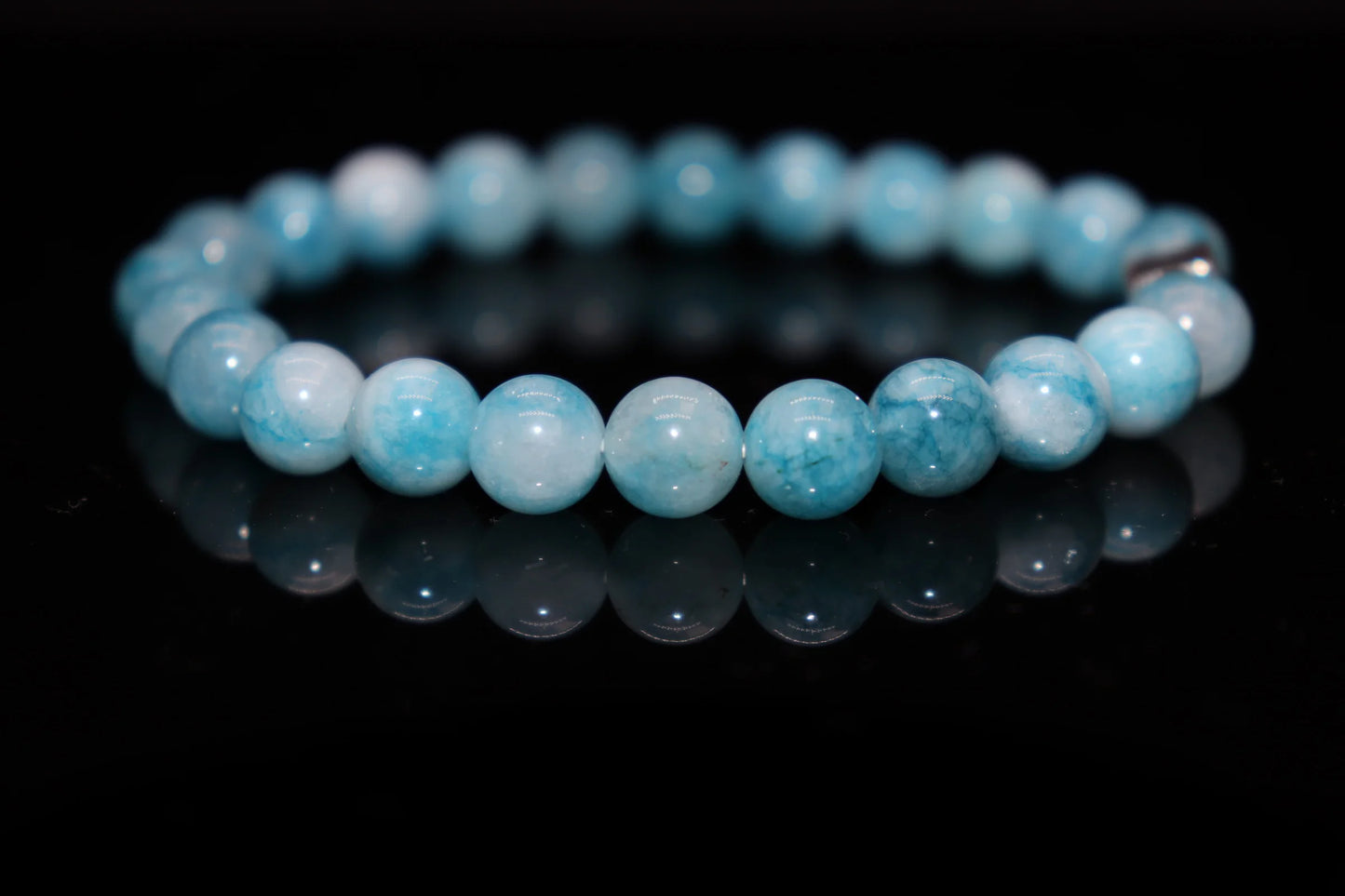 Larimar silver bracelet worn on wrist, throat chakra healing crystal jewelry for enhanced communication and emotional release, ocean energy accessory
