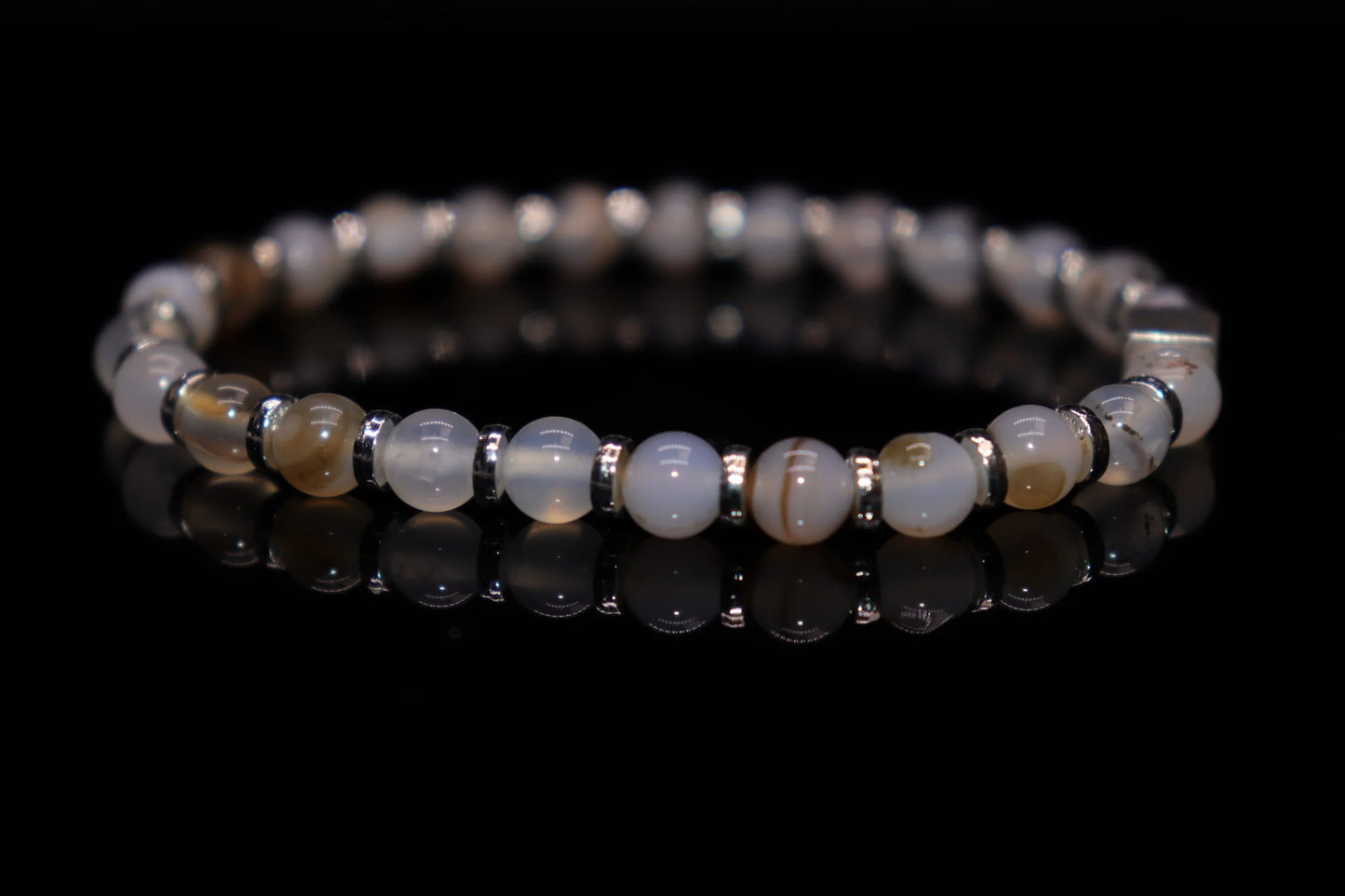 Close-up detail of moss agate bracelet showing intricate mossy dendritic patterns, Roman goddess Juno childbirth and fertility gemstone jewelry