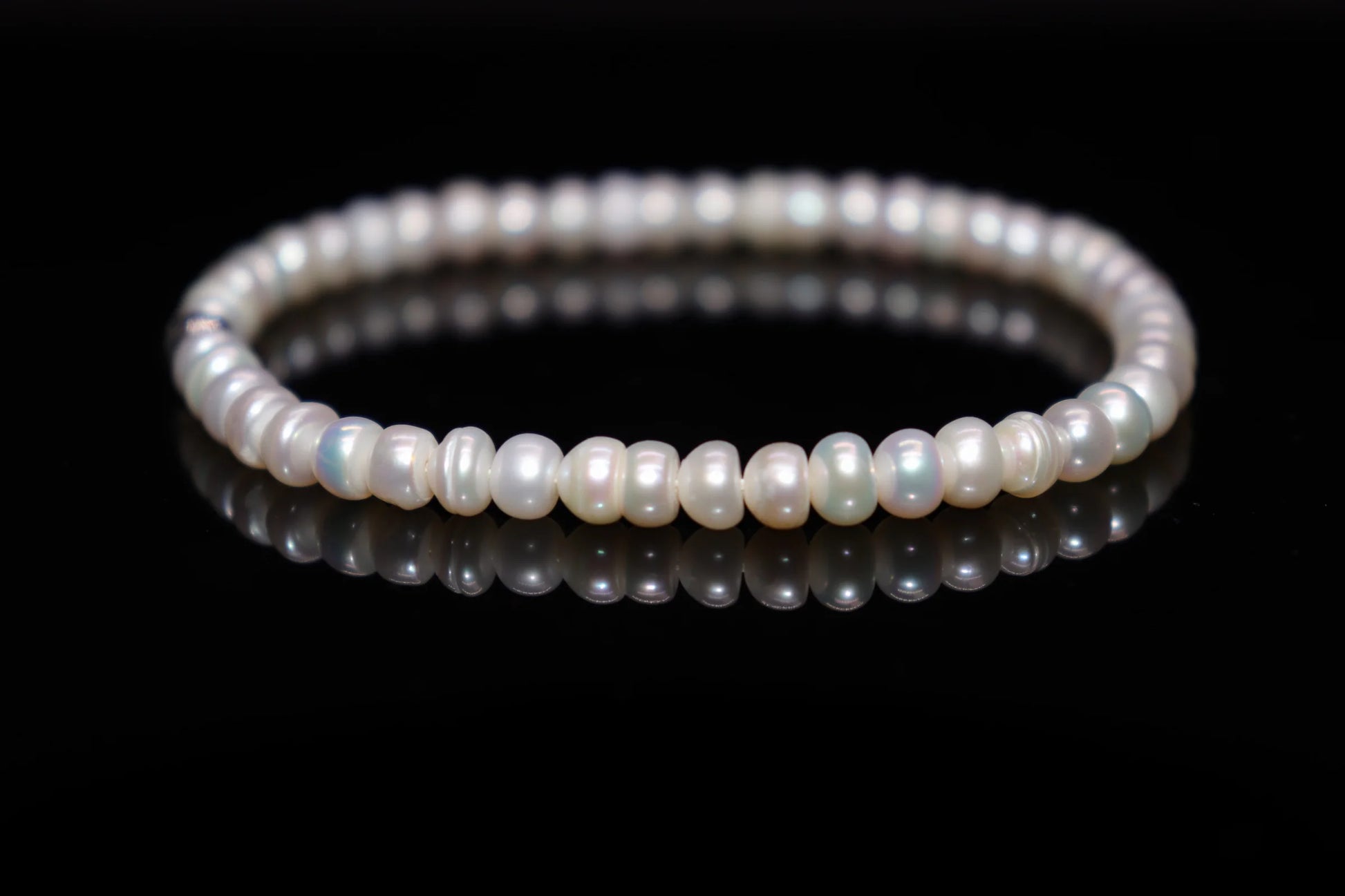 Pearl silver bracelet worn on wrist, classic timeless jewelry of power and dignity, Roman Caesar restricted to Senate class luxury accessory
