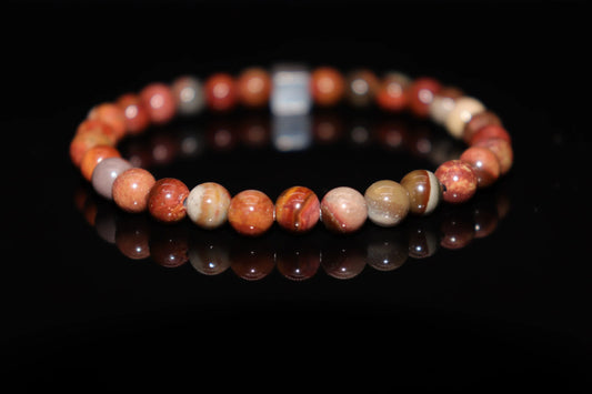 Close-up detail of petrified wood bracelet showing preserved ancient wood grain textures, fossilized over millions of years gemstone jewelry