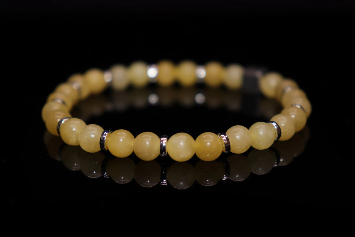 Close-up detail of topaz bracelet showing warm yellow crystal clarity and brilliance, sun god tears Greek Roman mythology gemstone jewelry