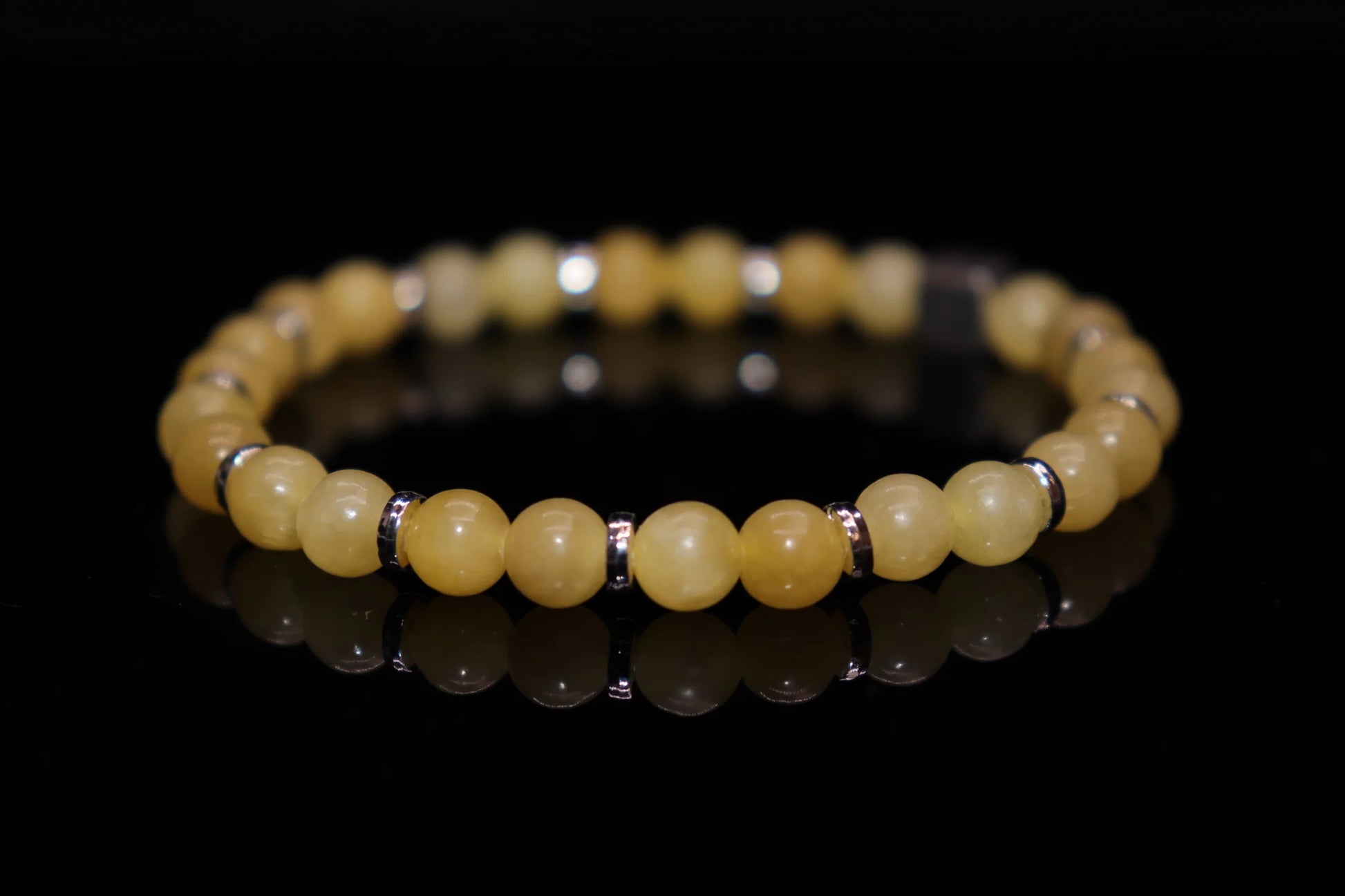 Close-up detail of topaz bracelet showing warm yellow crystal clarity and brilliance, sun god tears Greek Roman mythology gemstone jewelry