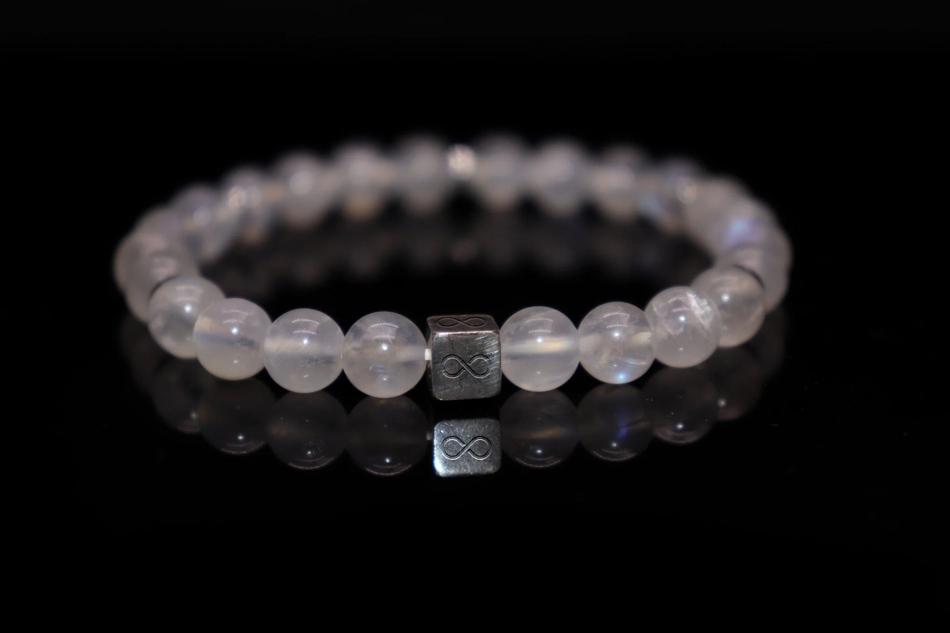 White moonstone silver bracelet 6mm with ethereal blue-white adularescent glow, solidified moonlight Roman moon goddess jewelry product photo